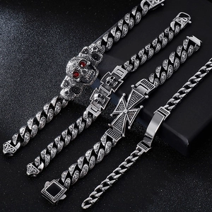 Retro 304 stainless steel punk bracelets with skull and cross charms on black background