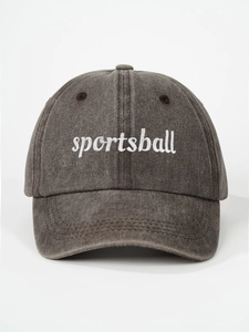 Detailed view of white sportsball embroidery on vintage washed dark gray baseball cap