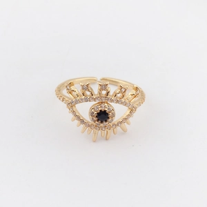 Macro shot of gold-plated evil eye ring featuring black crystal and white zircon pavé