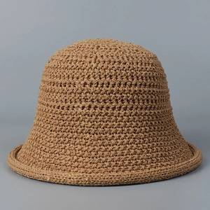 Close-up of the delicate hollow woven texture on a khaki bucket hat for women