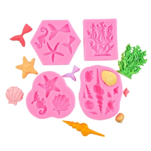 Pink silicone marine life molds for DIY cakes with starfish and seashell shapes