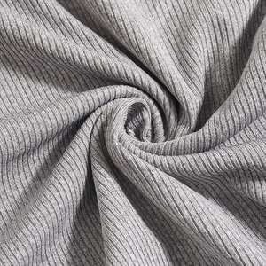 Close-up of grey ribbed knit fabric showing soft texture and elastic vertical patterns