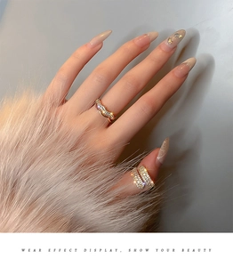 Detail of gold-plated double-layer ring featuring pavé zircons worn on hand