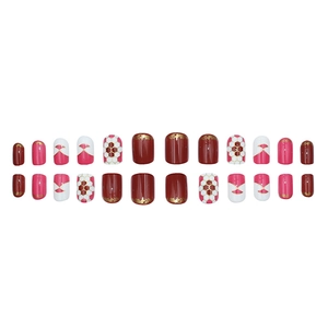 Deep red and white press-on nail set with geometric patterns and gold accents, 24 pieces