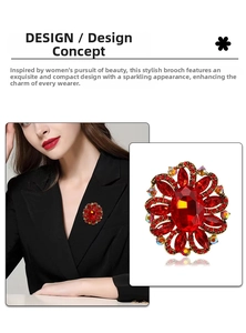 Detail of red floral crystal brooch with sparkling rhinestones on a golden alloy base