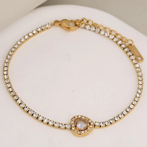 Elegant gold-plated stainless steel bracelet featuring sparkling rhinestones and heart pendant