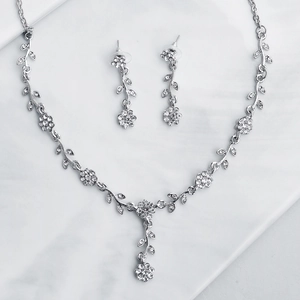 Elegant silver alloy floral necklace and earring bridal set with sparkling rhinestones