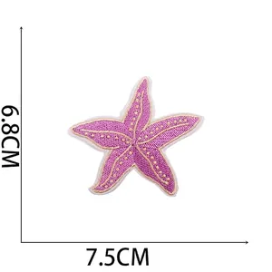 Purple starfish embroidery patch with yellow dots, dimensions 6.8x7.5cm and 1.8g weight