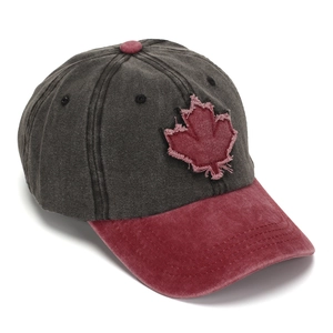 Close-up detail view of vintage washed baseball cap with 3D maple leaf embroidery