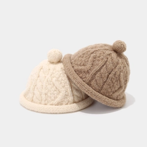 Japanese style cable knit docker hat with a small pompom in beige and light coffee colors