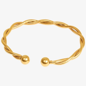 Macro view of 18k gold plated stainless steel twisted rope bracelet with ball ends