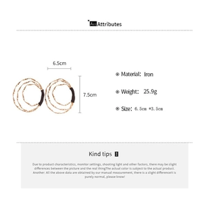 Detailed view of large gold twisted layered hoop earrings with dimensions and iron material spec