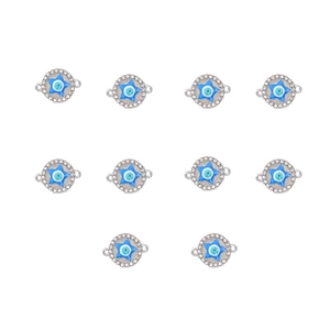 Macro detail of blue enamel devil eye charms with rhinestones for jewelry making
