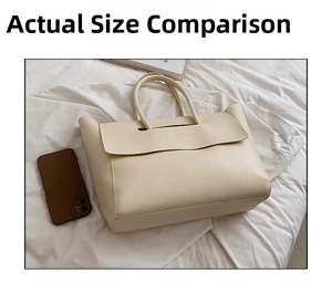 Close-up of cream leather tote bag with smartphone showing large interior capacity