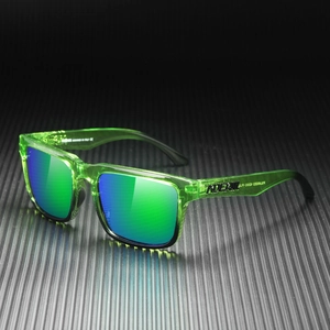 Detail of neon green transparent frame and blue polarized lens with ADER logo on the temple