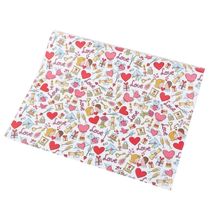 Detail of Valentine's gift wrapping paper featuring hand-drawn hearts and love motifs