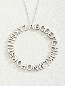 Detailed view of silver stainless steel alphabet ring pendant with 26 letters and O-chain