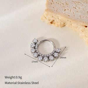 Macro shot of stainless steel seamless nose ring with crystals and 14mm-17mm dimensions