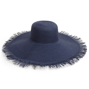 Detail of navy blue straw sun hat featuring intricate weave and frayed tassel brim edge