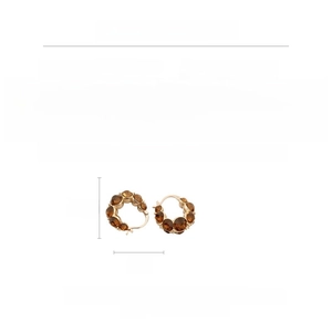 Macro view of crystal gold earrings showing dimensions 2.2x2cm and weight 10.2g