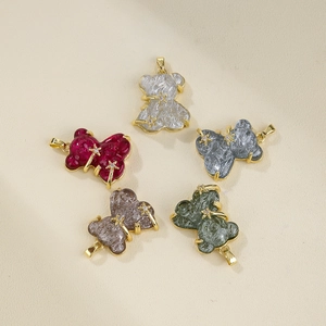 Pendentifs ours en résine colorée avec détails étoiles dorées et bordure