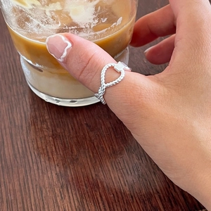 Minimalist 925 sterling silver woven twisted rope open ring worn on thumb over coffee cup