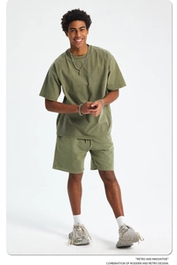 Detailed texture of heavy 420g washed cotton fabric on military green retro shorts