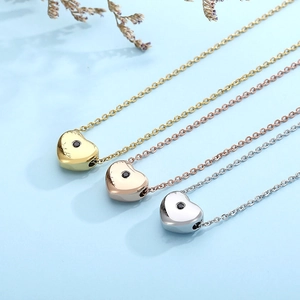 Minimalist heart pendant necklace set in gold, rose gold, and silver stainless steel