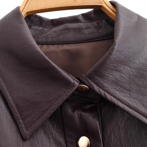 Deep brown faux leather long coat with golden buttons and waist belt detail