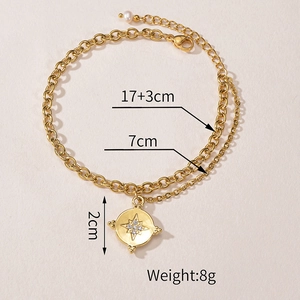 Detail of layered gold bracelet with star pendant, pearl charm, and size measurements