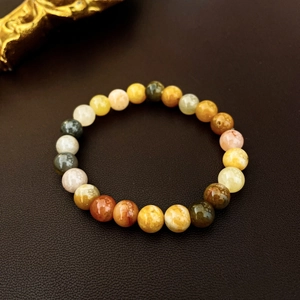 Close-up of multicolor ceramic and agate beads on a stretch bracelet with Chinese style