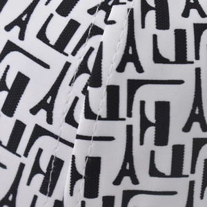Macro shot of Paris monogram pattern on baseball cap with durable double-stitched seams