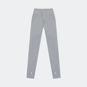 Macro detail of high-waist charcoal grey athletic leggings with white cross logo on the cuff