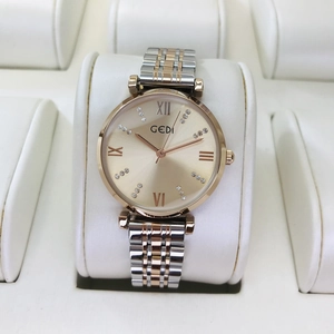 Close-up of GEDI ladies watch with champagne dial and gold-tone steel strap in box
