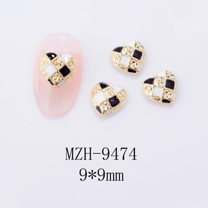 Detail of 9x9mm Y2K heart nail charms with black and white checkerboard enamel