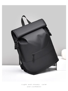 Close-up of black waterproof roll-top backpack with stylish matte texture and folding closure