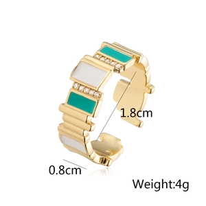 Detail view of gold plated adjustable ring with green enamel and zircon stones dimensions
