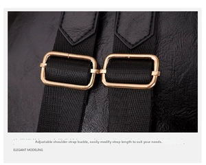 Detail of black leather backpack straps with adjustable gold metal buckles and webbing