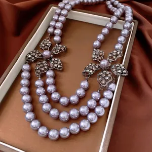 French vintage lavender triple pearl necklace with hollow rhinestone flower motifs