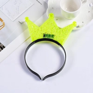Detail of glow-in-the-dark LED crown headband in neon yellow for party decorations