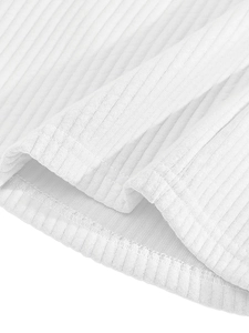 Close-up of white corduroy fabric texture and ribbed stitching details on men's shorts