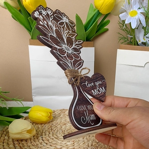 Detailed view of dark wooden Mother's Day flower bouquet gift with twine bow and heart tag