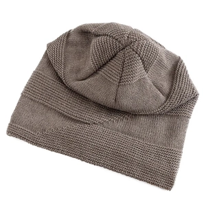 Detailed close-up of textured chunky knit beanie in dark coffee brown winter wool style