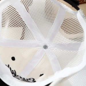 Close-up of the breathable white mesh interior and durable stitching of the baby sun hat