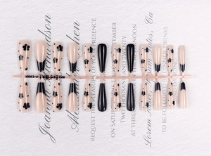 French ballerina press-on nails with nude base, black floral patterns and tips