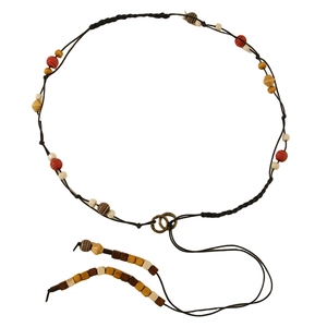 Detail of bohemian braided waist chain featuring colorful beads and metal buckles