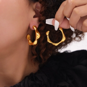 Minimalist irregular chunky gold C-shaped hoop earrings for women in polished finish