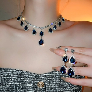 Vintage luxury blue teardrop gemstone necklace and earring set with shimmering crystals