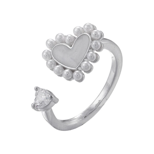 Detailed shot of silver heart ring featuring white pearls and a clear zircon stone