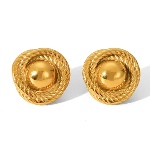 Macro detail of gold-plated stainless steel stud earrings with twisted rope texture edge